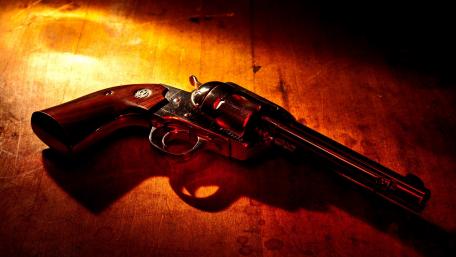 Classic Revolver on Wooden Surface wallpaper