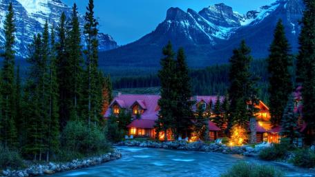 Cozy village between high mountains wallpaper