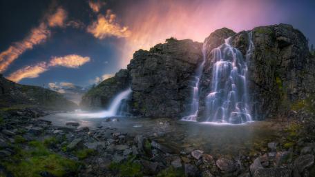 Majestic Waterfall Under Vibrant Sky wallpaper