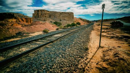 Railroad Journey Through Rugged Landscapes wallpaper