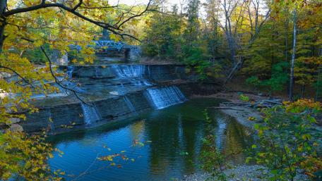 Tranquil Autumn Waterfall Scene wallpaper