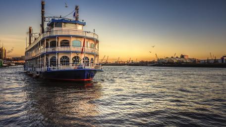 Serene Sunset Over the Waterway with a Ferry Ship wallpaper