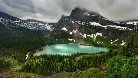 Serene Highland Lake in a Majestic Wilderness Scene wallpaper