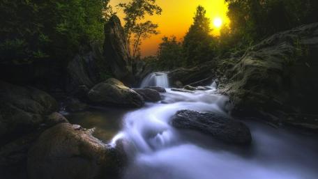 Majestic Waterfall at Sunset in Forest wallpaper