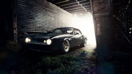 Classic Chevrolet Camaro in a Vintage Barn Setting wallpaper
