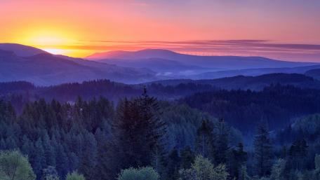 Majestic Dawn Over Serene Mountains wallpaper