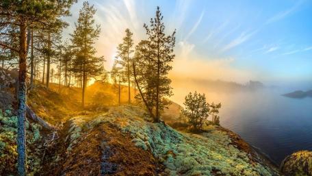 Serene Sunrise Over Misty Mountain Lake wallpaper