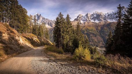 Serene Mountain Path in Winter Landscape wallpaper