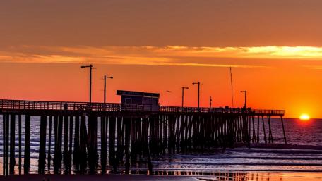 Serene Sunset Over Tranquil Pier wallpaper