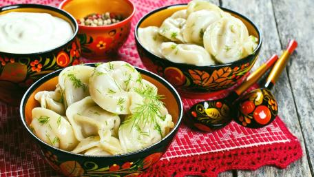 Delicious Pelmeni Served in Colorful Bowls wallpaper