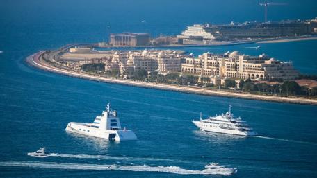 Luxurious Vessels Navigating Serene Waters wallpaper