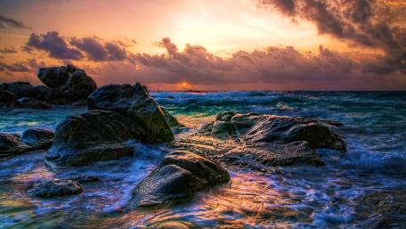 Sunset Waves on a Rocky Shoreline wallpaper