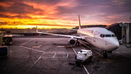Sunset Sky Over Waiting Airliner wallpaper