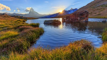 Sunset above mountain lake wallpaper