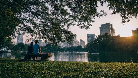 Man and woman sitting on a bench wallpaper