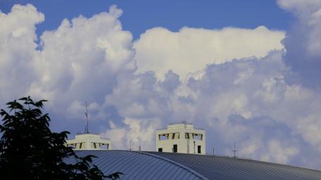 Clouds Over City Roofs wallpaper