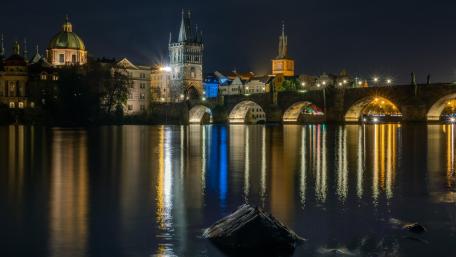 Charles Bridge above the Vltava River at night wallpaper