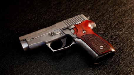 Classic Handgun on Display in Detail wallpaper