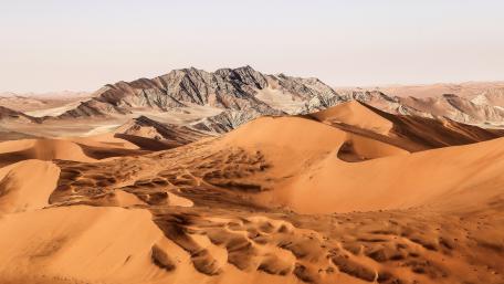 Majestic Desert Dunes and Mountains wallpaper