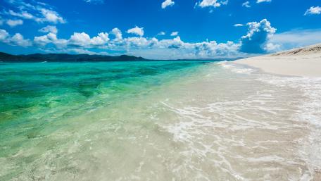 Pristine Beach and Azure Waters wallpaper