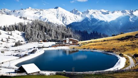 Serene Winter Retreat by the Glacial Lake wallpaper