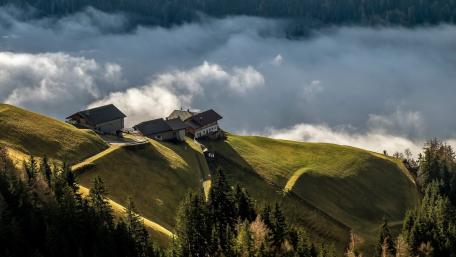 Serene Mountain Village Above the Misty Clouds wallpaper