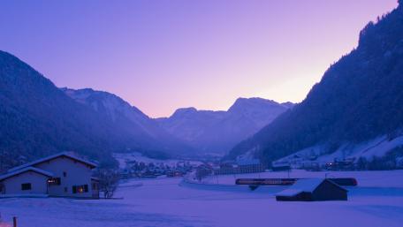Serene Twilight Over a Snowy Mountain Village wallpaper