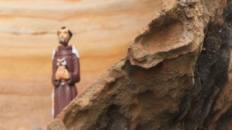 Statue behind the rock wallpaper