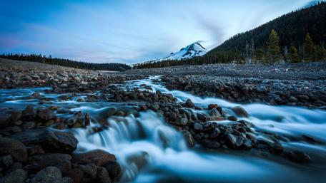 Serene Winter River in Majestic Mountains wallpaper