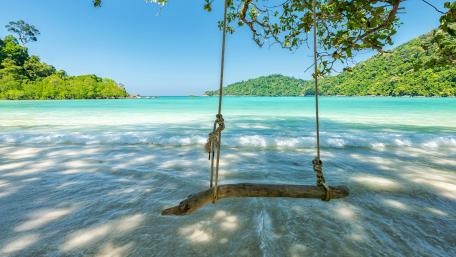Swing over the ocean wallpaper