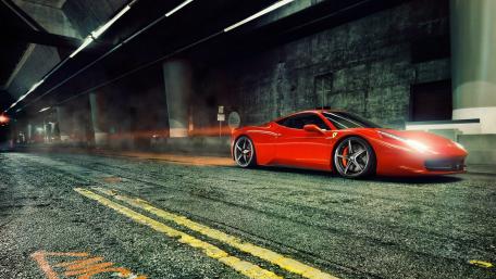 Sleek Red Supercar on Urban Roadway wallpaper