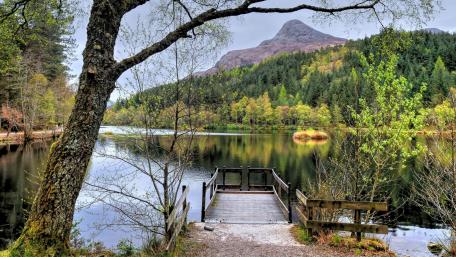 Pier to a mountain lake wallpaper