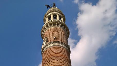 Majestic City Tower Against a Blue Sky wallpaper