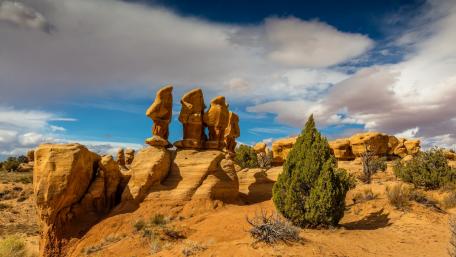 Majestic Badlands Under Dramatic Clouds wallpaper
