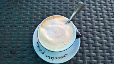 Coffee in a Charming Café Setting wallpaper