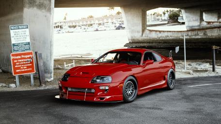 Red Sports Car Beneath the Bridge wallpaper