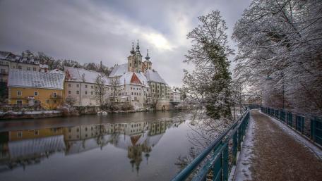 Winter Serenity in a Snowy Town By the River wallpaper