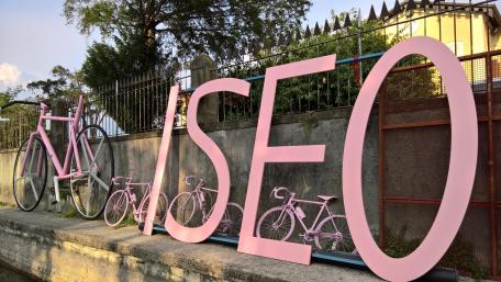 Pink bicycle and letters wallpaper