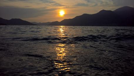 Tranquil Sunset Over Water Landscape wallpaper