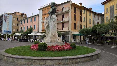 Charming City Square with Historic Statue wallpaper