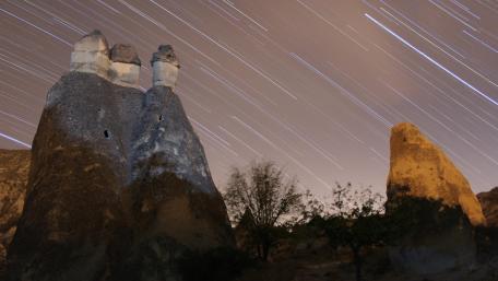 Star trails over the rocks wallpaper