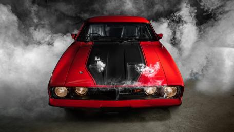 Classic Red Sports Car in Smoke wallpaper