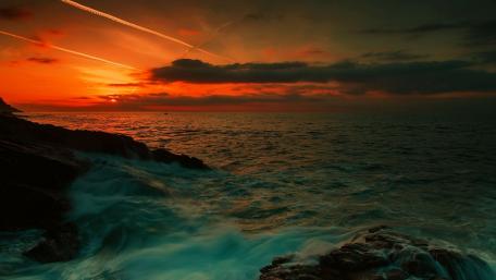 Fiery Sunset Over Tranquil Seascape wallpaper