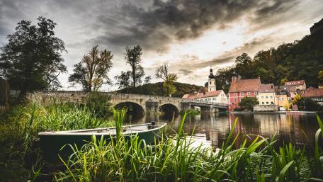 Cozy village next to a river wallpaper