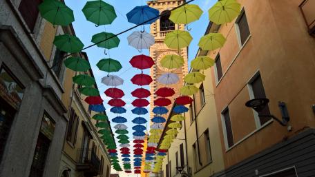 Colorful Umbrella Canopy in Vibrant City Scene wallpaper