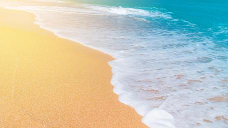 Foam on the beach wallpaper
