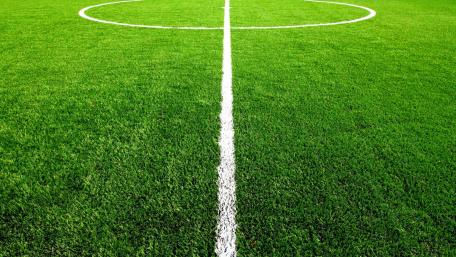Lush Green Football Field Wallpaper wallpaper
