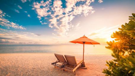 Sunbeds on the sandy beach wallpaper