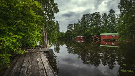 Crumbling red boathouses wallpaper