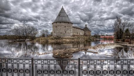 Majestic Castle by the Serene Lake Under Dramatic Skies wallpaper
